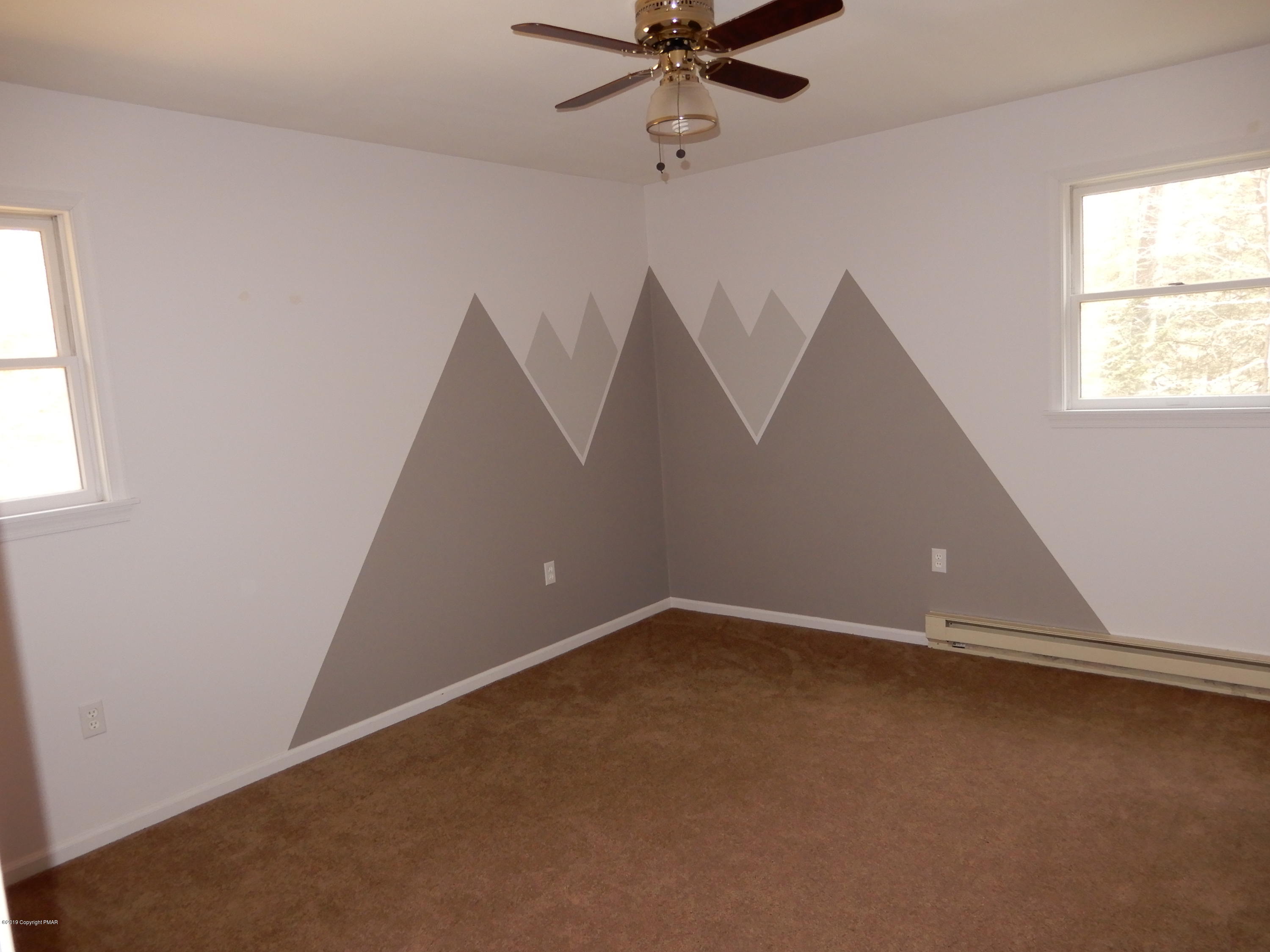 1712 Vineyard Road Stroudsburg, PA 18360 - Photo 21 of 38 an empty room with windows and fan
