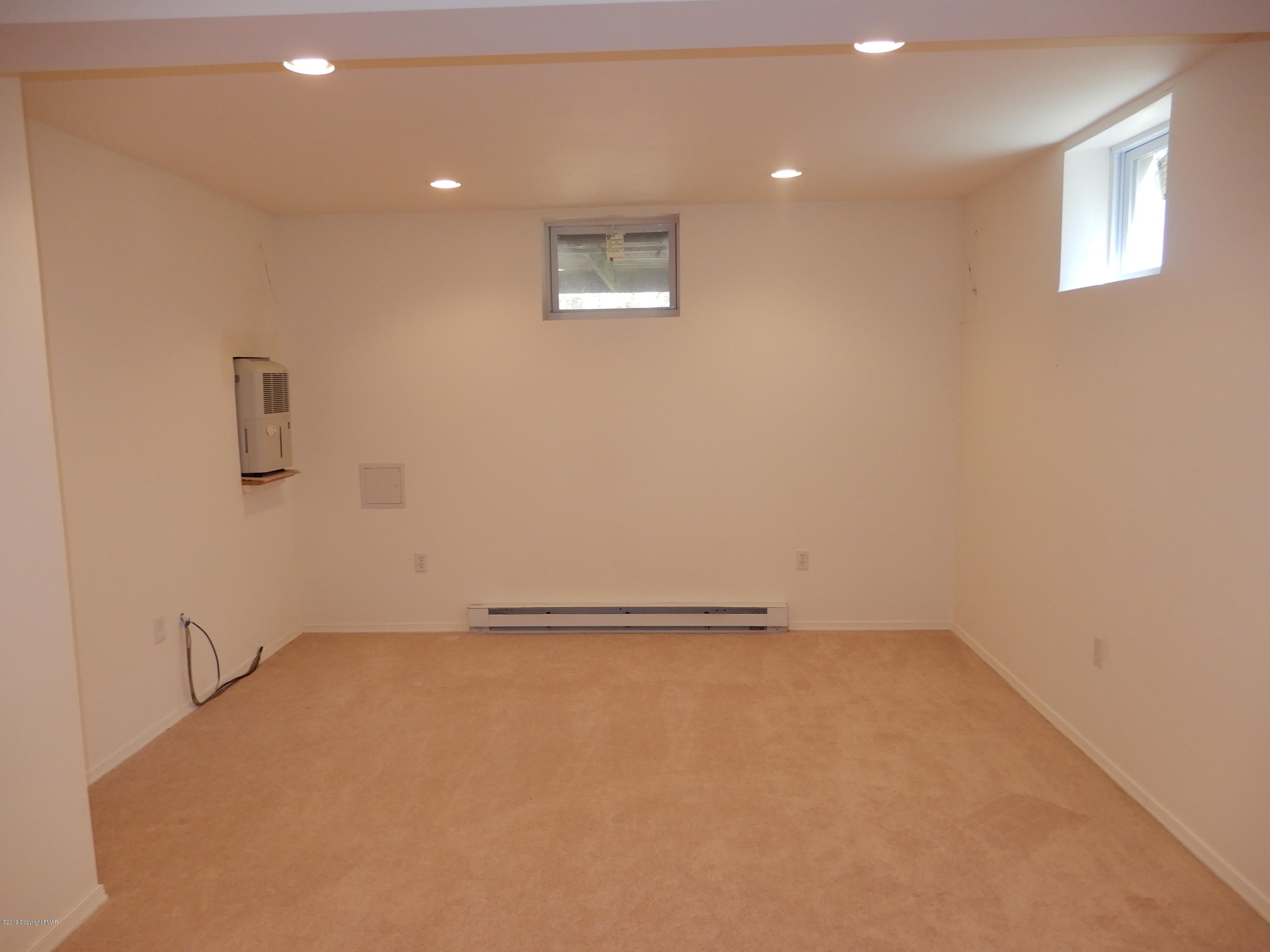 1712 Vineyard Road Stroudsburg, PA 18360 - Photo 28 of 38 an empty room with a workbench