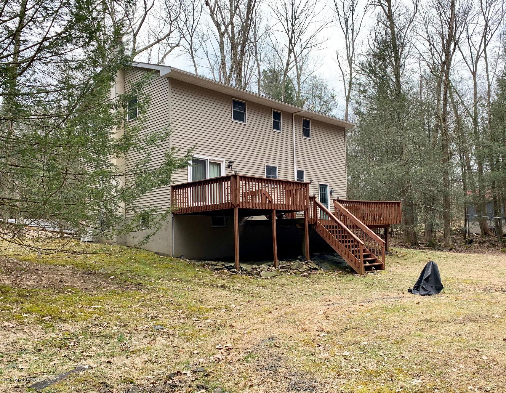 1712 Vineyard Road Stroudsburg, PA 18360 - Photo 34 of 38 a view of a house with a yard and sitting area