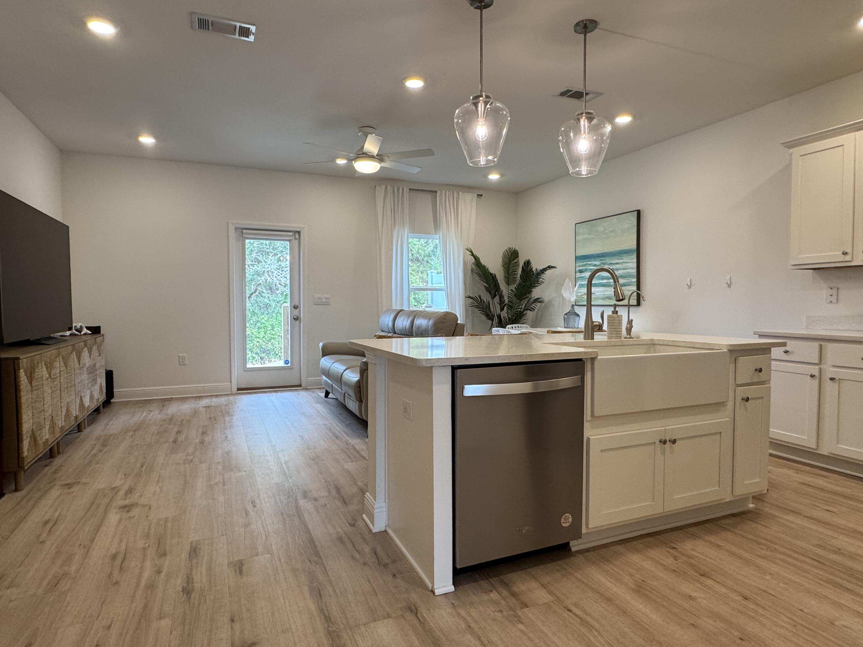 40 Redbird Loop Destin, FL 32541 - Photo 1 of 14 a kitchen with a sink and wooden floor