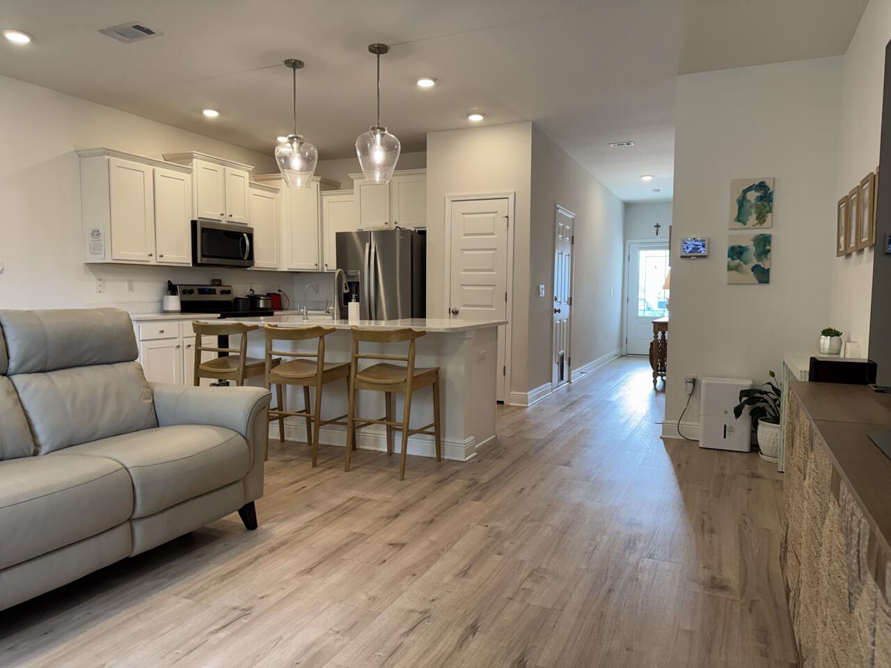 40 Redbird Loop Destin, FL 32541 - Photo 2 of 14 a living room with furniture kitchen view and a wooden floor