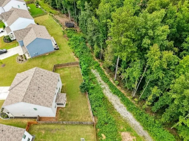 an aerial view of a house with swimming pool