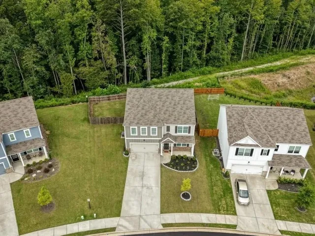an aerial view of residential house with outdoor space