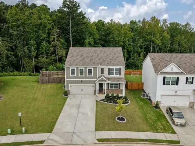 aerial view of a house with yard