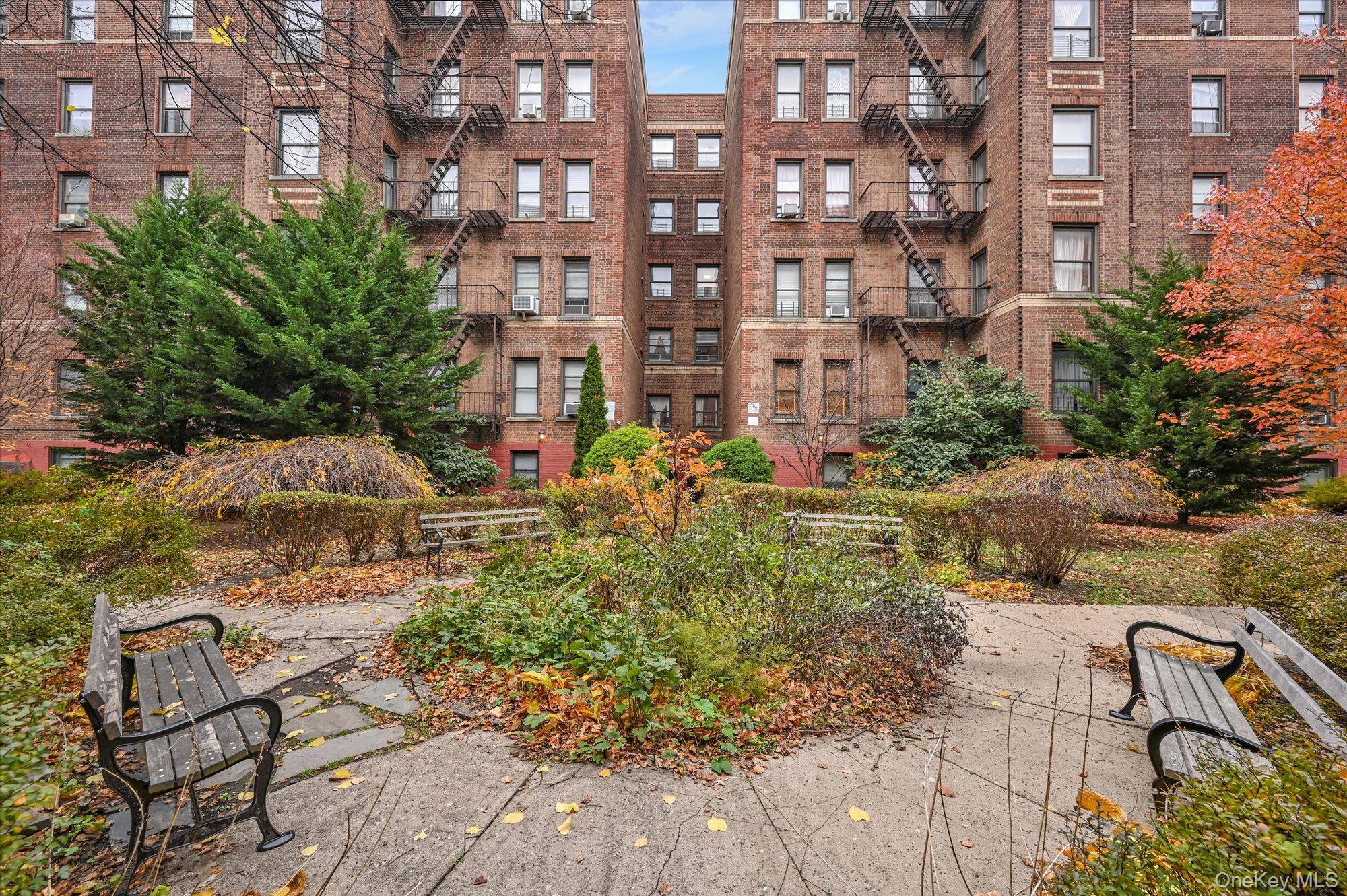 37-16 80th Street, Unit 2 Queens, NY 11372 - Photo 16 of 18 a view of building with yard and outdoor seating