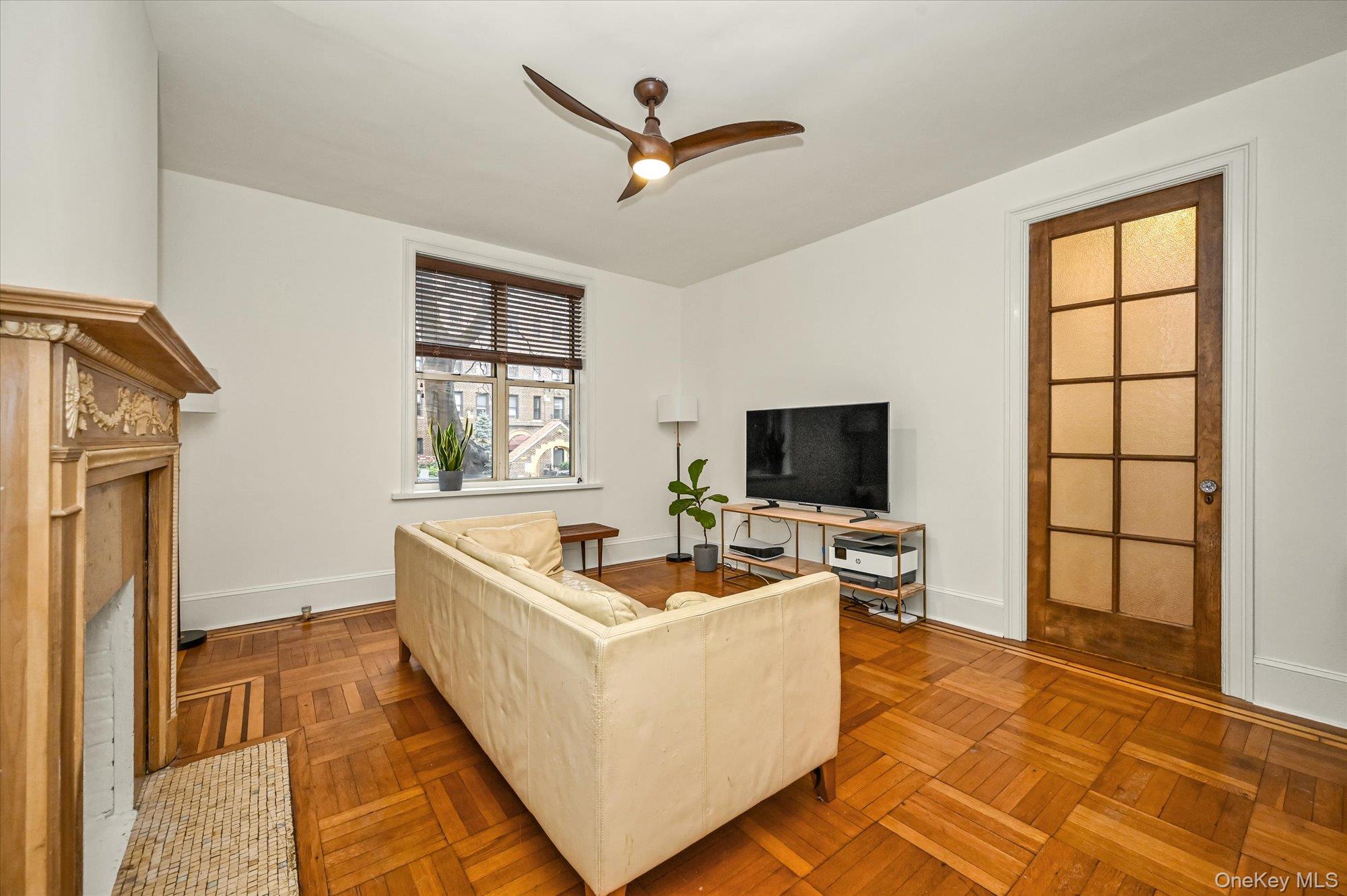 37-16 80th Street, Unit 2 Queens, NY 11372 - Photo 2 of 18 a living room with furniture and a flat screen tv
