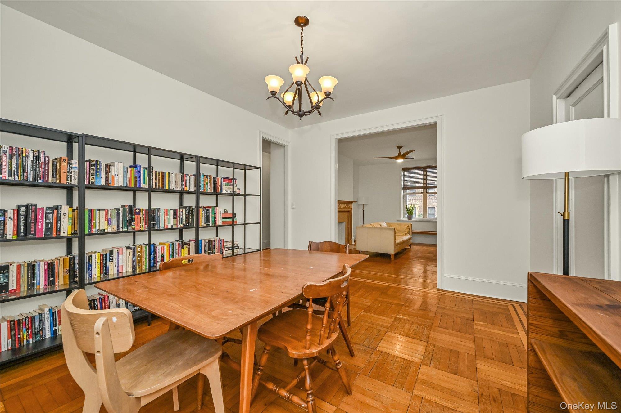 37-16 80th Street, Unit 2 Queens, NY 11372 - Photo 4 of 18 a view of a dining room with furniture and a chandelier