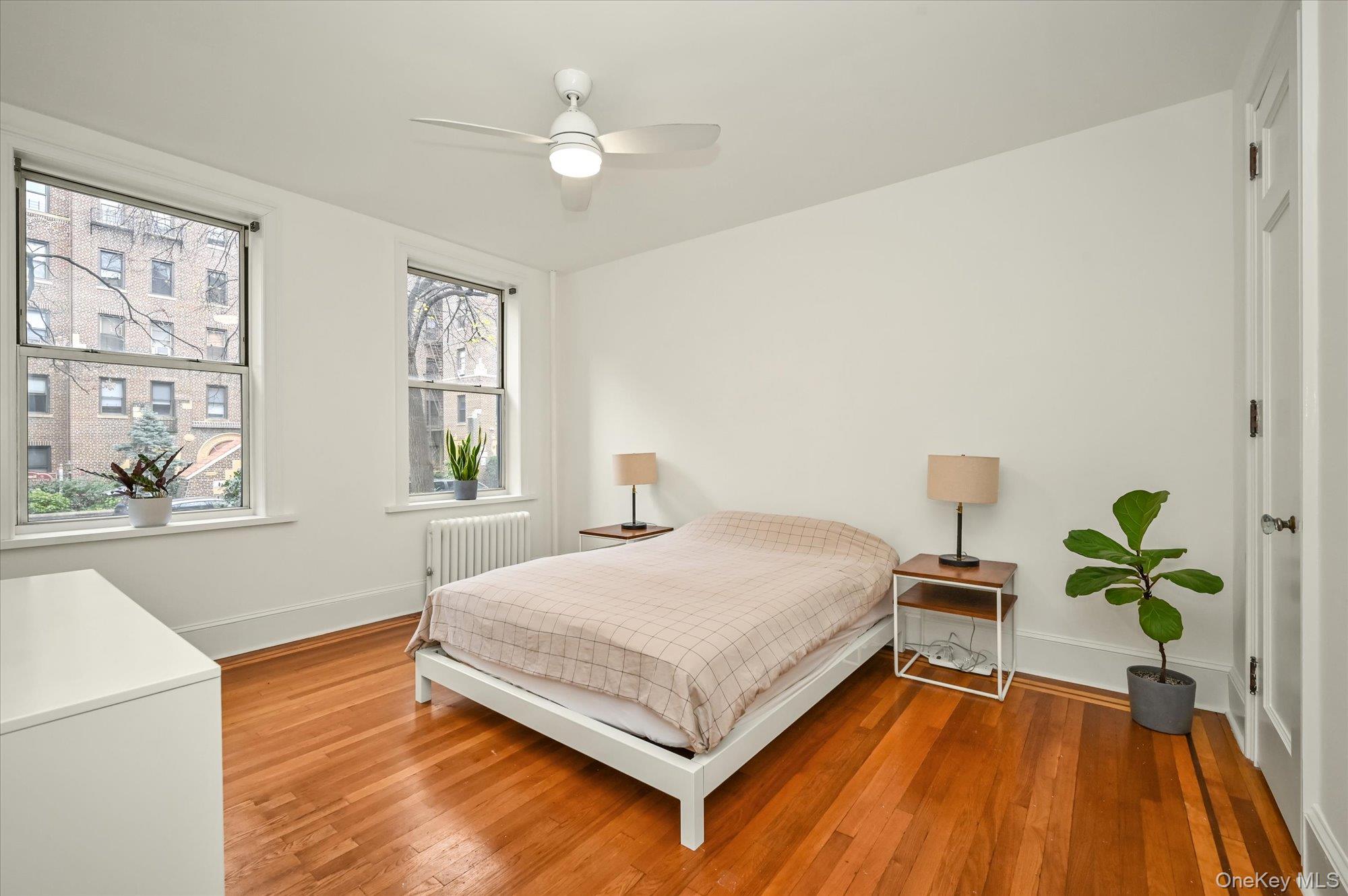 37-16 80th Street, Unit 2 Queens, NY 11372 - Photo 9 of 18 a bedroom with a bed and a window