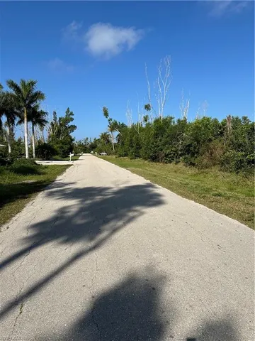 a view of a lake with houses in the back