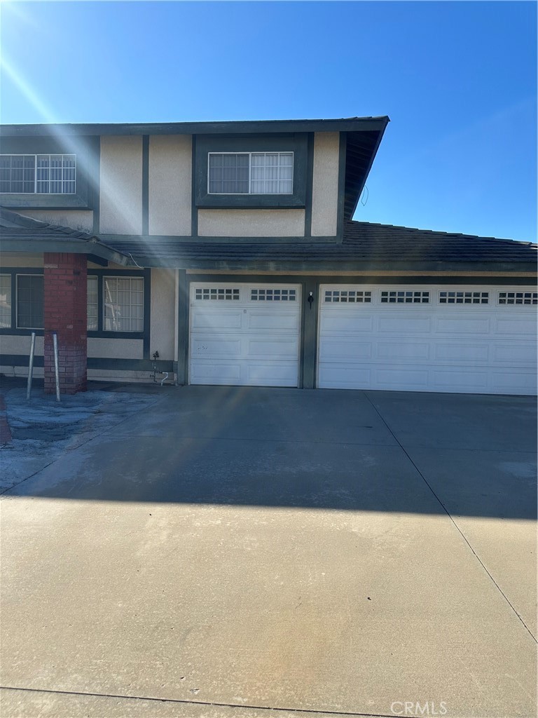 1029-1029 West Madrona Street Rialto, CA 92376 - Photo 17 of 19 a kitchen with granite countertop a stove and a microwave