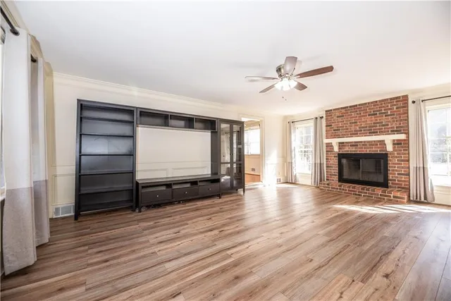 a view of a room with a table and chairs