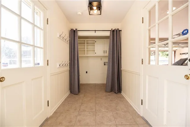 a bathroom with a granite countertop window a toilet and a shower