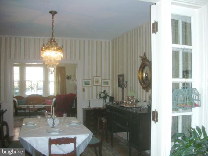 3903 Canterbury Road Baltimore, MD 21218 - Photo 1 of 27 a dining room with furniture and window