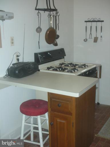 3903 Canterbury Road Baltimore, MD 21218 - Photo 3 of 27 a stove top oven sitting inside of a kitchen