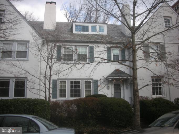 3903 Canterbury Road Baltimore, MD 21218 - Photo 8 of 27 a front view of a residential apartment building with a yard