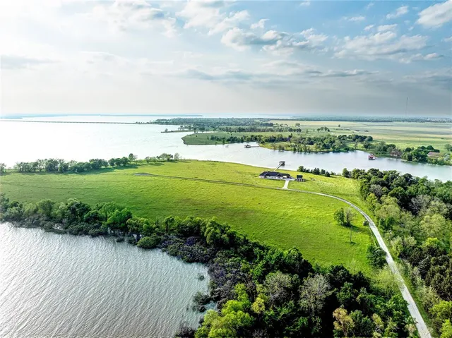 a view of a lake with a big yard