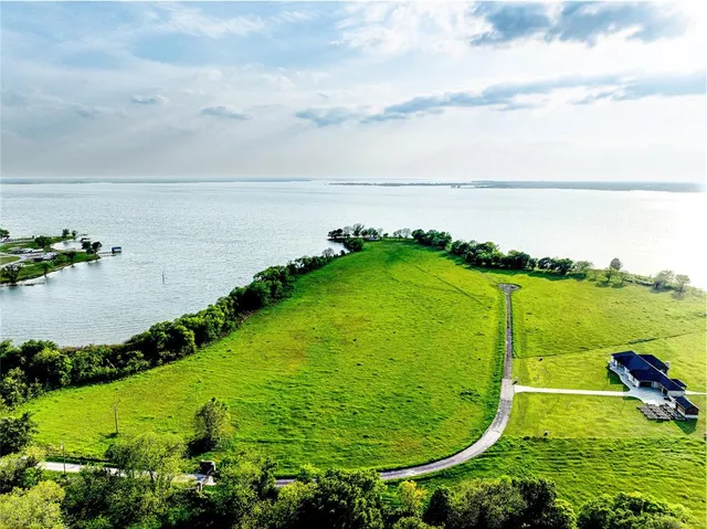 a view of a lake with a big yard