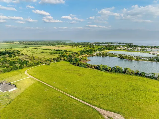 a view of a lake with a big yard