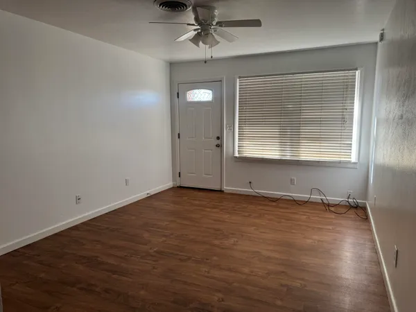 a view of an empty room with a window