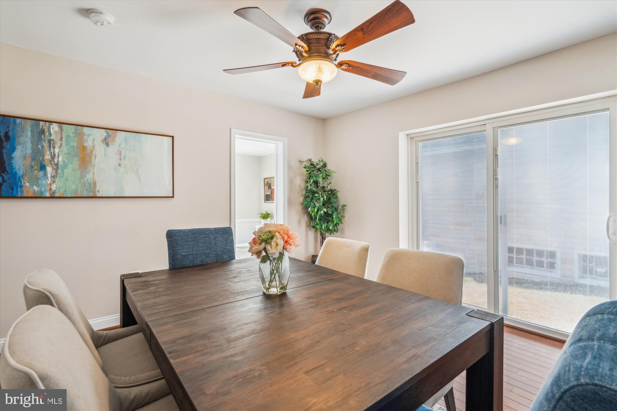 10117 High Ridge Road Laurel, MD 20723 - Photo 16 of 70 a view of a dining room with furniture and wooden floor