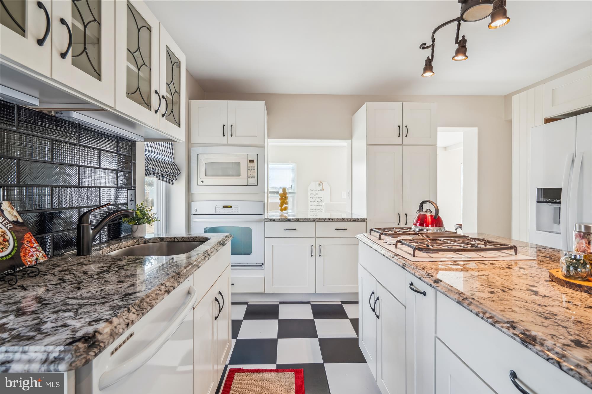 10117 High Ridge Road Laurel, MD 20723 - Photo 24 of 70 a kitchen with stainless steel appliances granite countertop a sink stove and cabinets