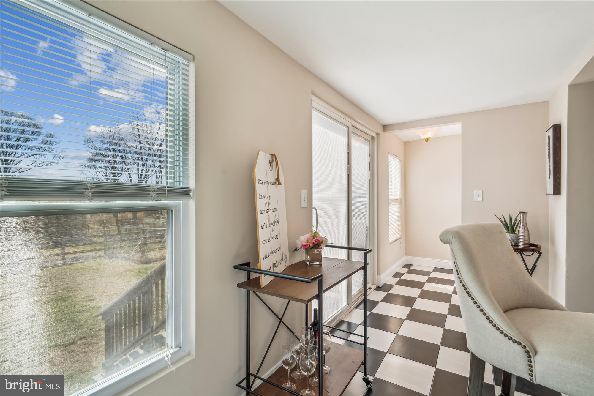 10117 High Ridge Road Laurel, MD 20723 - Photo 29 of 70 a living room with furniture and a floor to ceiling window