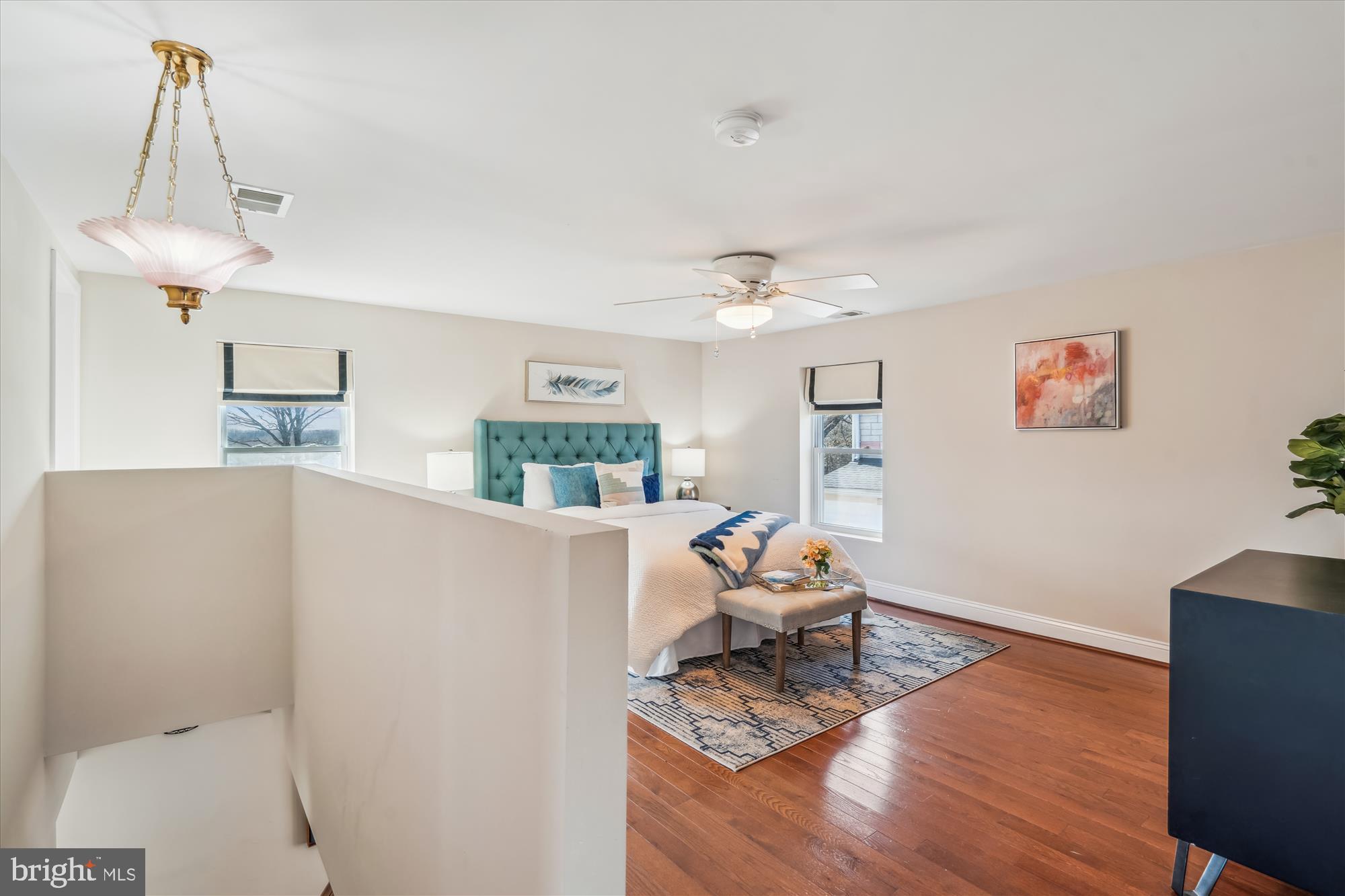 10117 High Ridge Road Laurel, MD 20723 - Photo 36 of 70 a living room with furniture and a chandelier