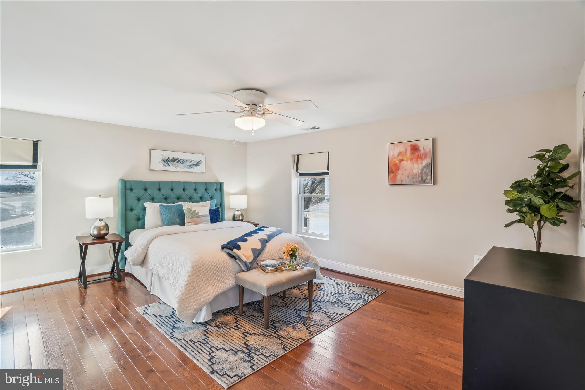 10117 High Ridge Road Laurel, MD 20723 - Photo 37 of 70 a bedroom with a bed and a chandelier