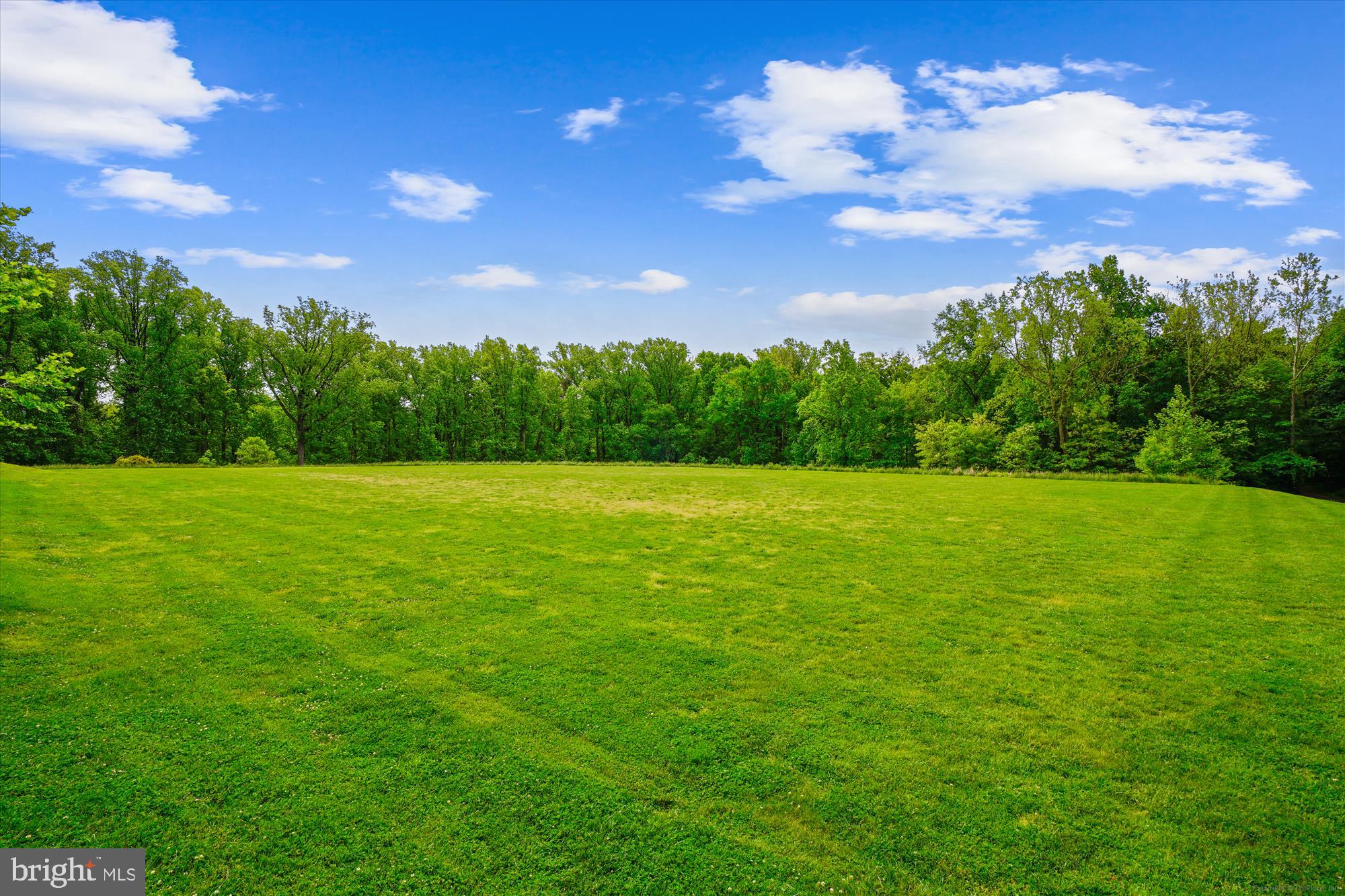 10117 High Ridge Road Laurel, MD 20723 - Photo 65 of 70 a view of a green field with a building in the background