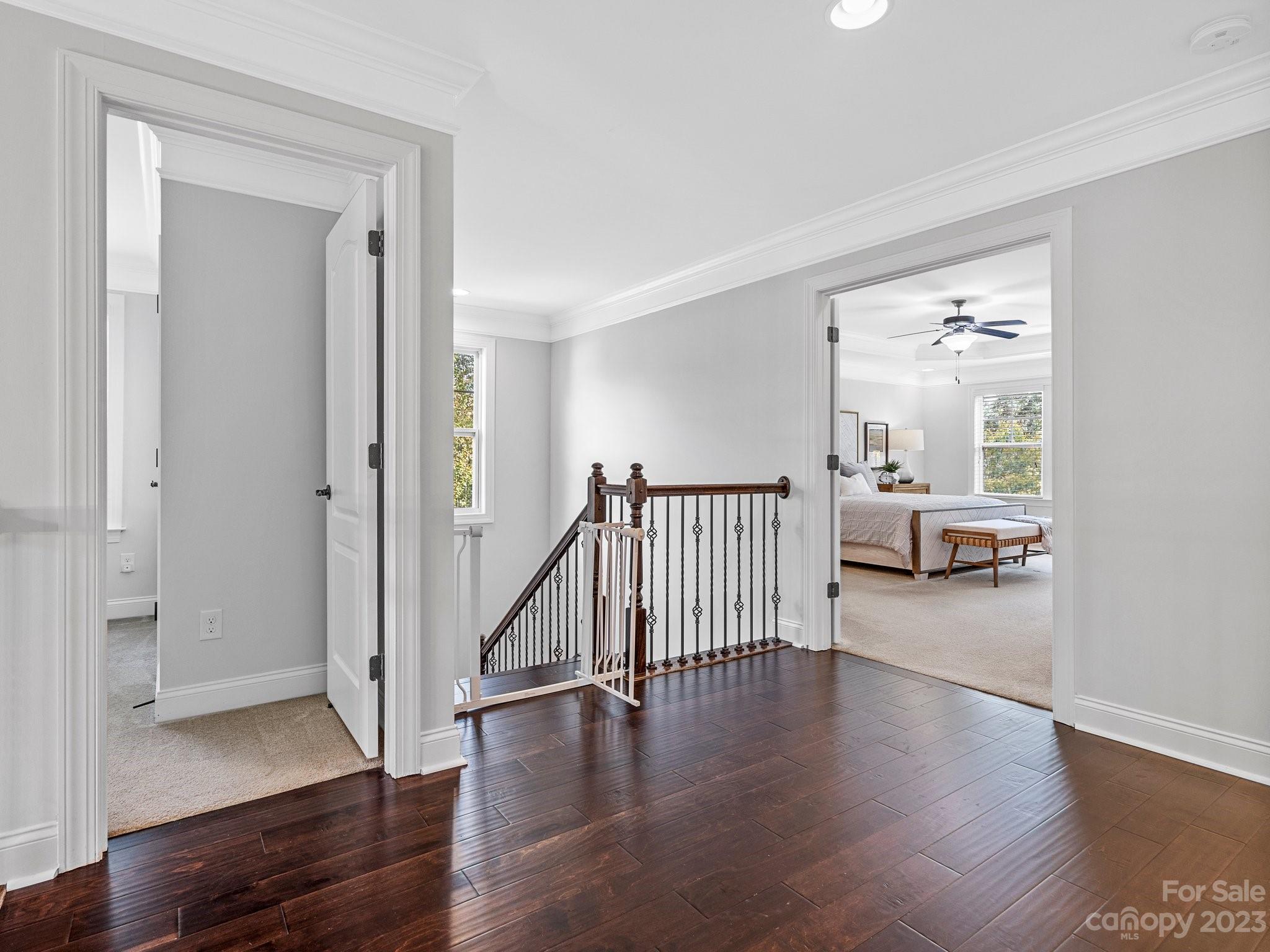 1021 Ridgehaven Road Waxhaw, NC 28173 - Photo 15 of 36 a view of a hallway view with wooden floor and windows