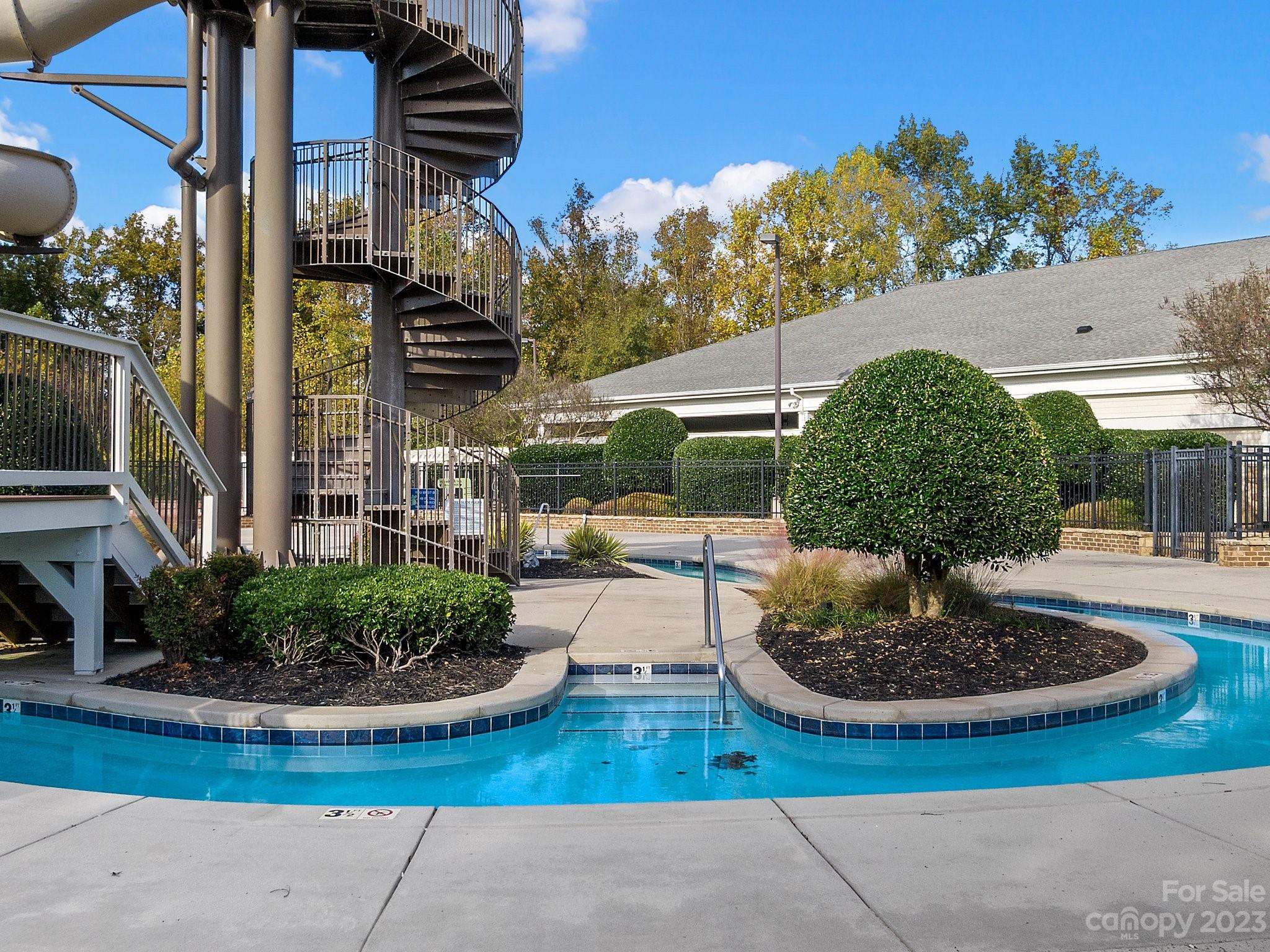 1021 Ridgehaven Road Waxhaw, NC 28173 - Photo 36 of 36 a view of a patio with table and chairs potted plants