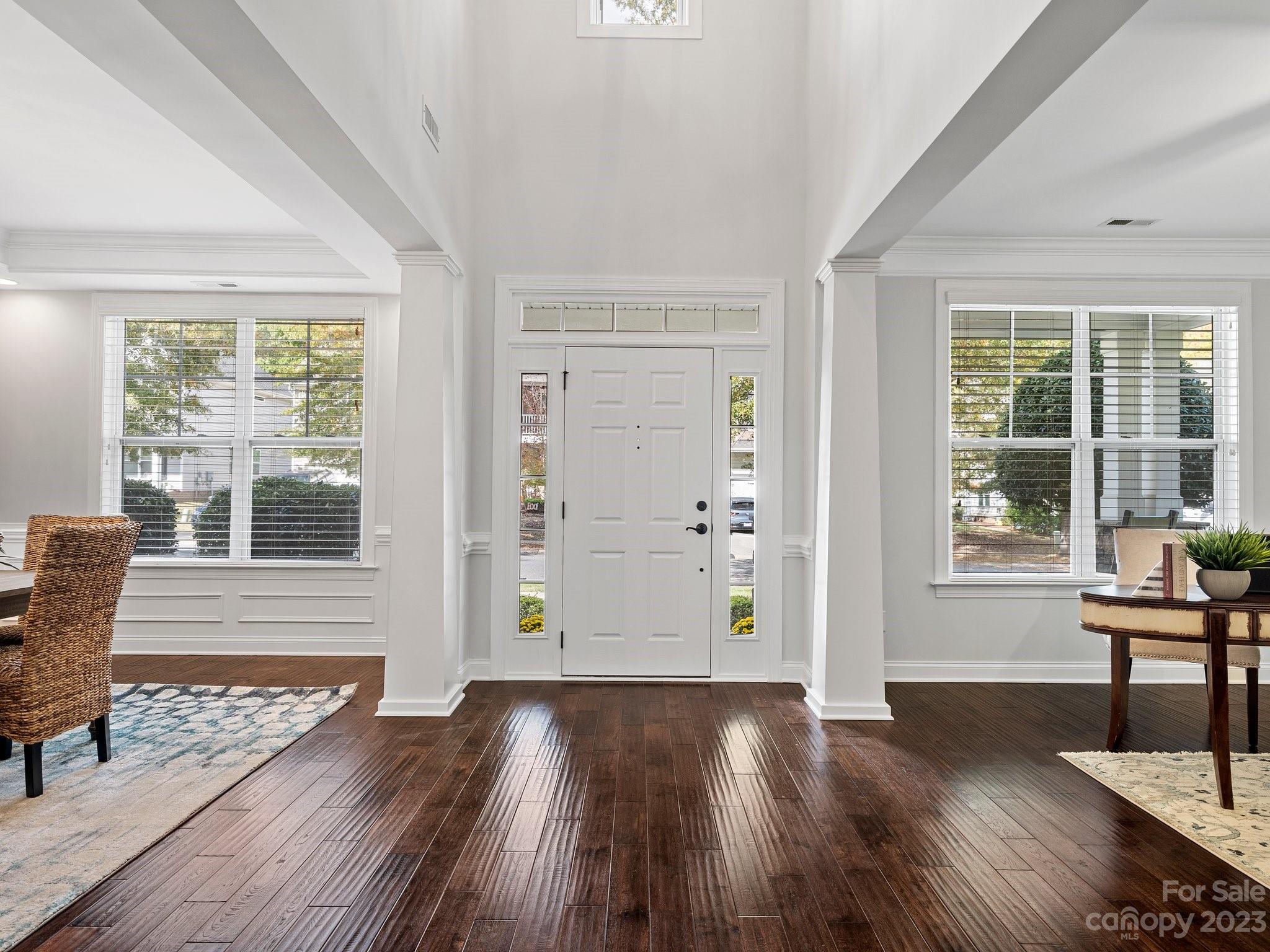 1021 Ridgehaven Road Waxhaw, NC 28173 - Photo 4 of 36 a view of a livingroom with wooden floor and furniture