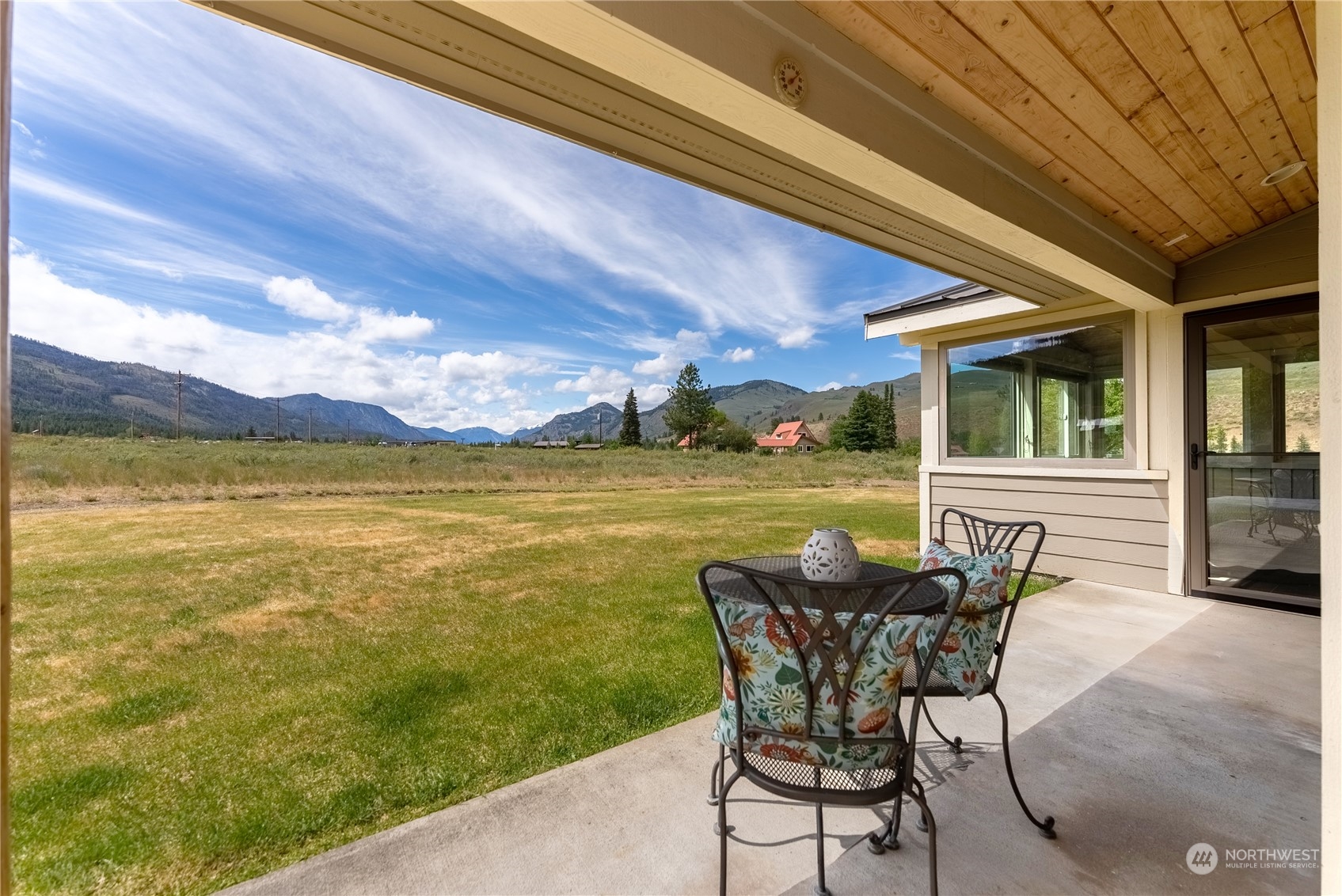5 Wolfden Road Winthrop, WA 98862 - Photo 12 of 40 a view of a swimming pool with a table and chairs in patio