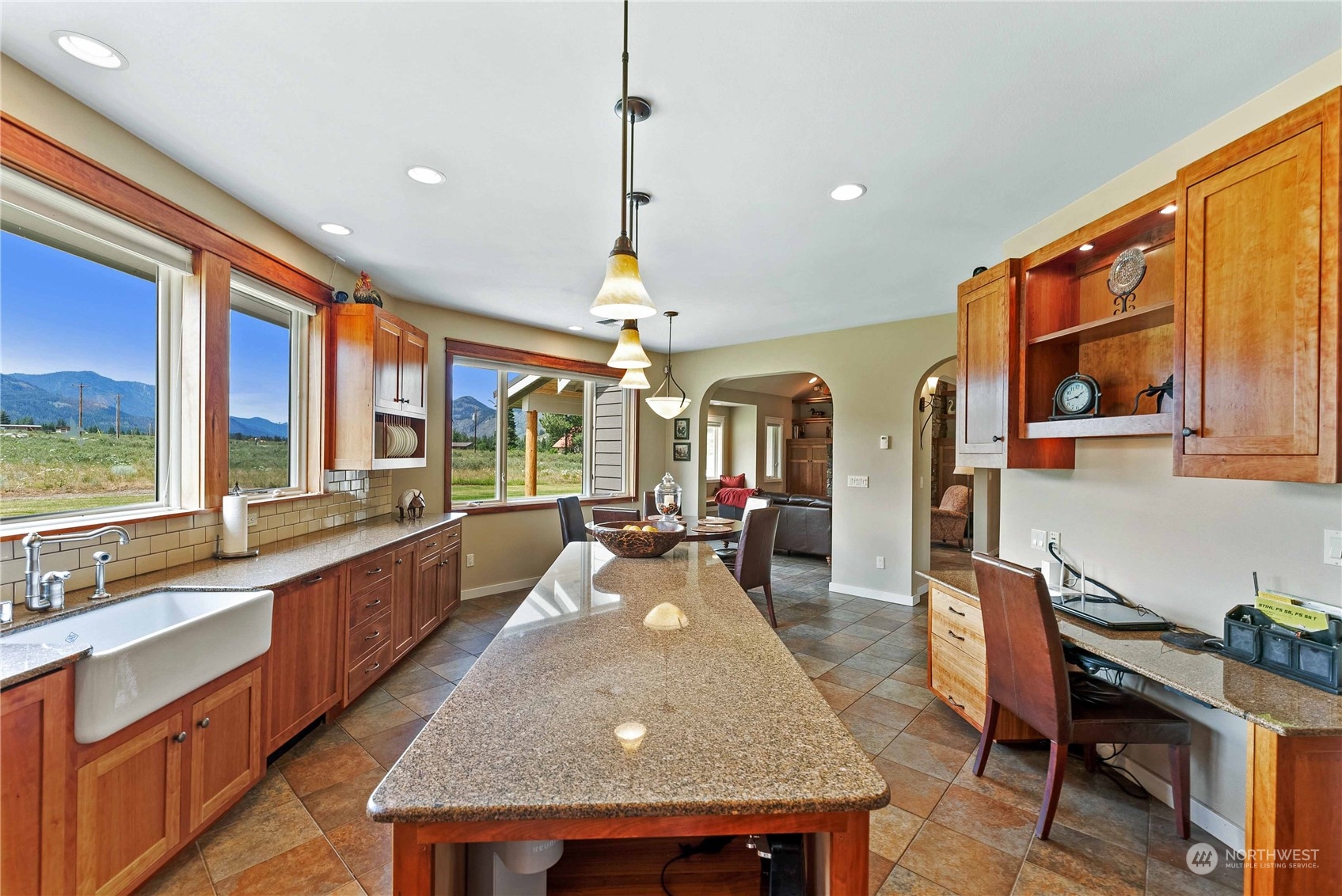 5 Wolfden Road Winthrop, WA 98862 - Photo 17 of 40 a dining hall with stainless steel appliances granite countertop a stove and a sink