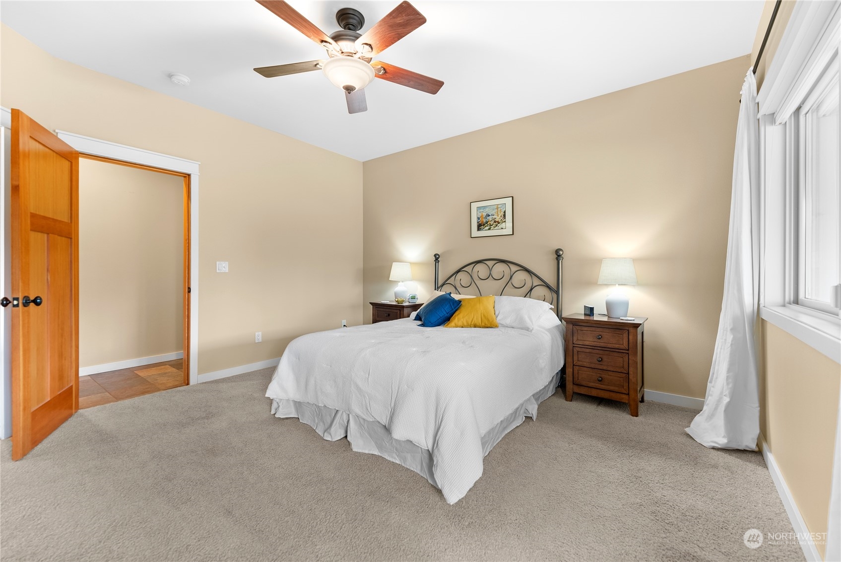 5 Wolfden Road Winthrop, WA 98862 - Photo 18 of 40 a bedroom with a bed and a chandelier