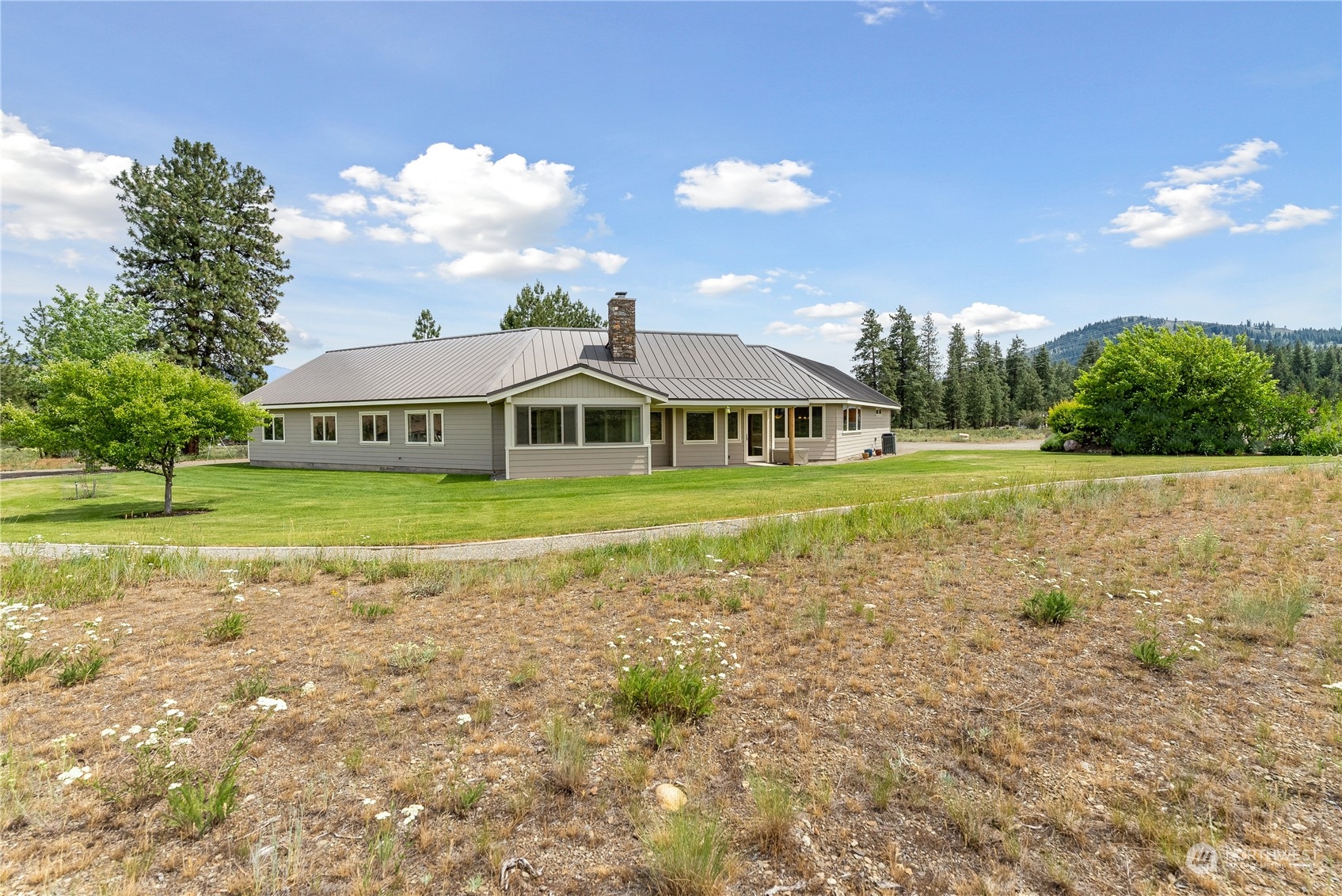 5 Wolfden Road Winthrop, WA 98862 - Photo 40 of 40 a view of house with outdoor space and swimming pool