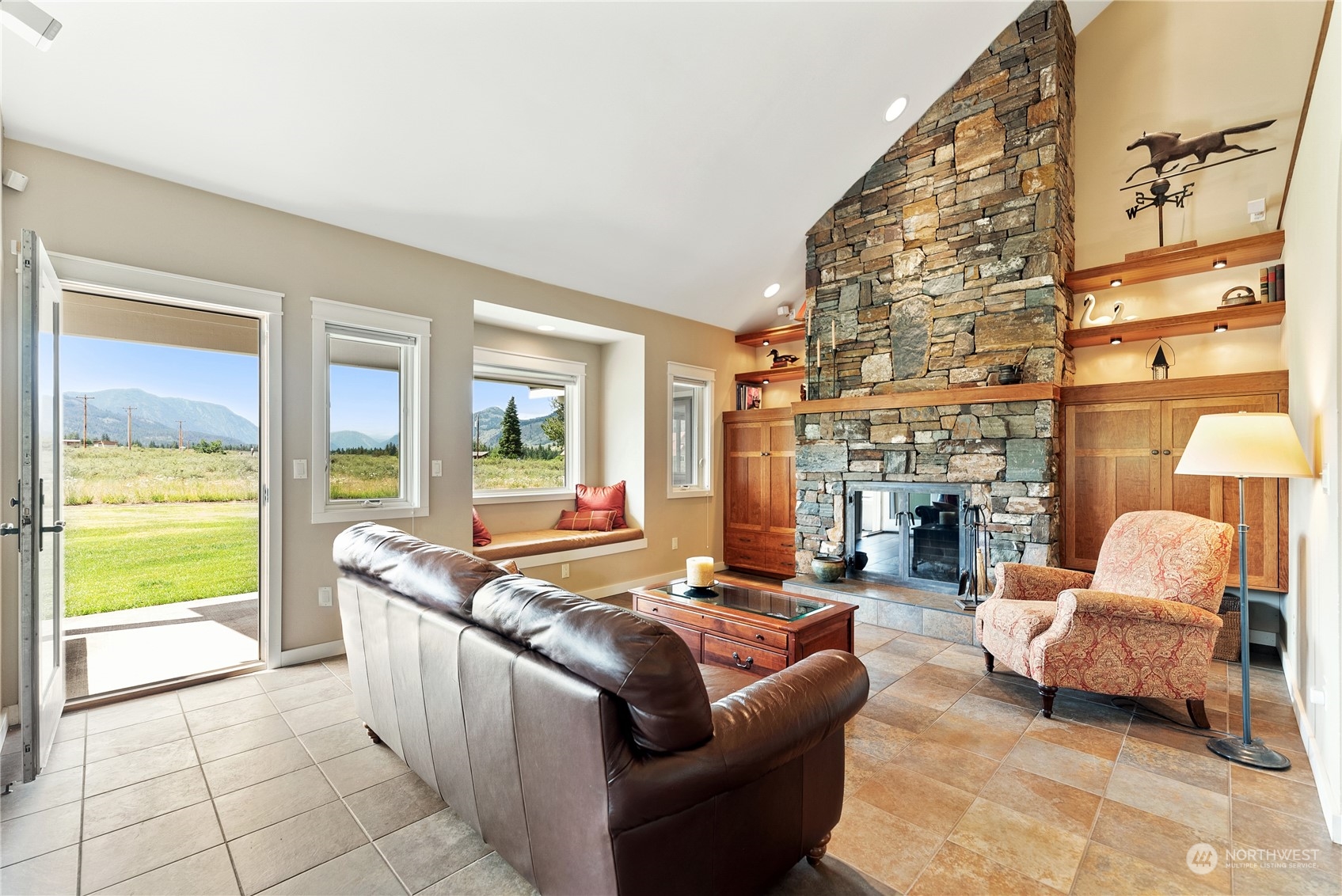 5 Wolfden Road Winthrop, WA 98862 - Photo 8 of 40 a living room with furniture and a fireplace