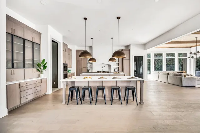 a stove top oven sitting inside of a kitchen