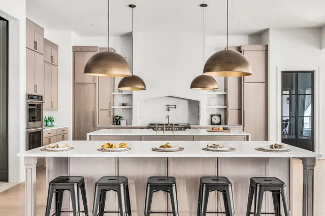 a white stove top oven sitting inside of a kitchen