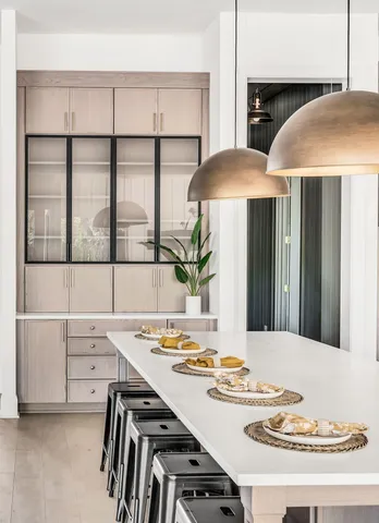 a bathroom with a sink a vanity and a mirror