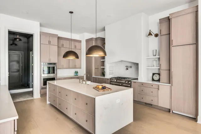a bathroom with a large tub sink and window