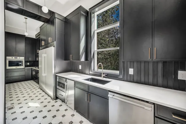 a bathroom with a double vanity sink and a mirror