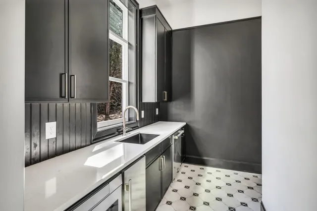 a spacious bathroom with a tub sink and mirror