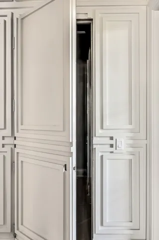 an aerial view of residential house with outdoor space and trees all around