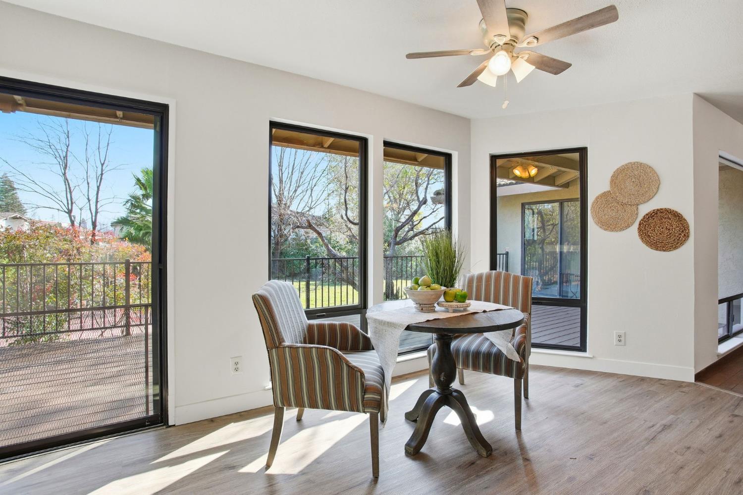 6923 Pera Drive Rancho Murieta, CA 95683 - Photo 15 of 35 a dining room with furniture a chandelier and wooden floor