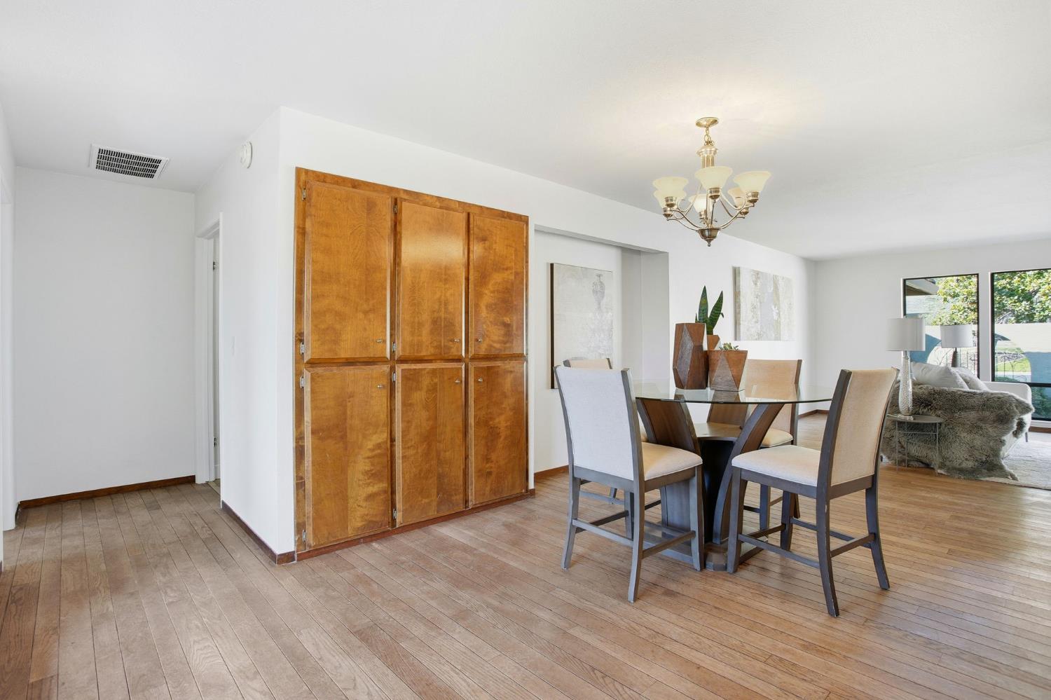 6923 Pera Drive Rancho Murieta, CA 95683 - Photo 16 of 35 a view of a dining room with furniture and wooden floor