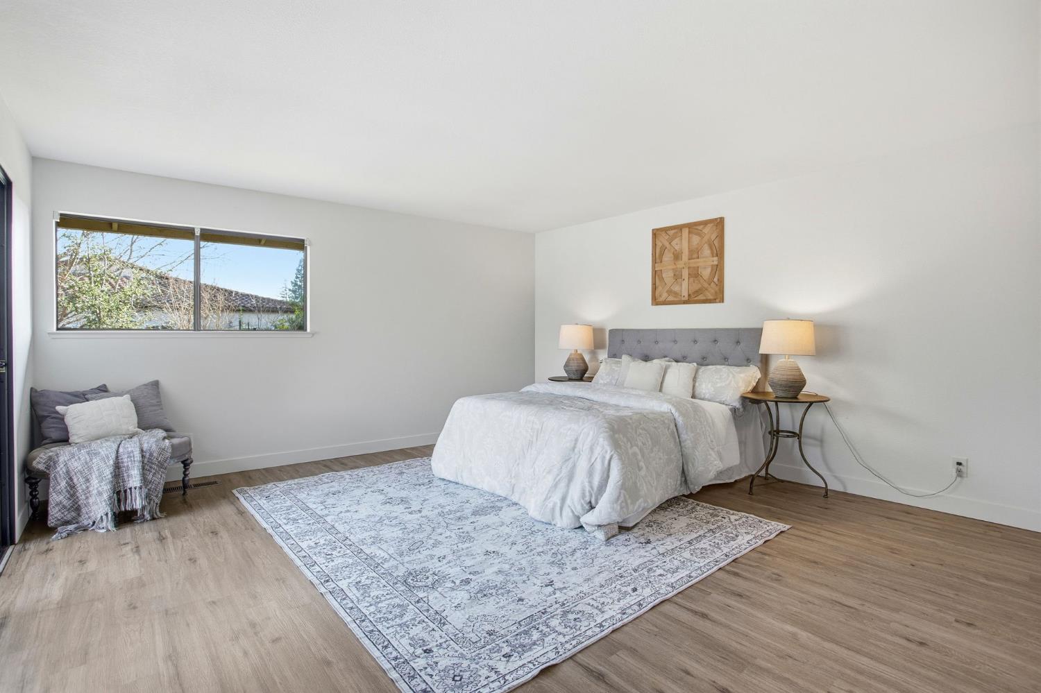 6923 Pera Drive Rancho Murieta, CA 95683 - Photo 18 of 35 a bedroom with a bed and wooden floor