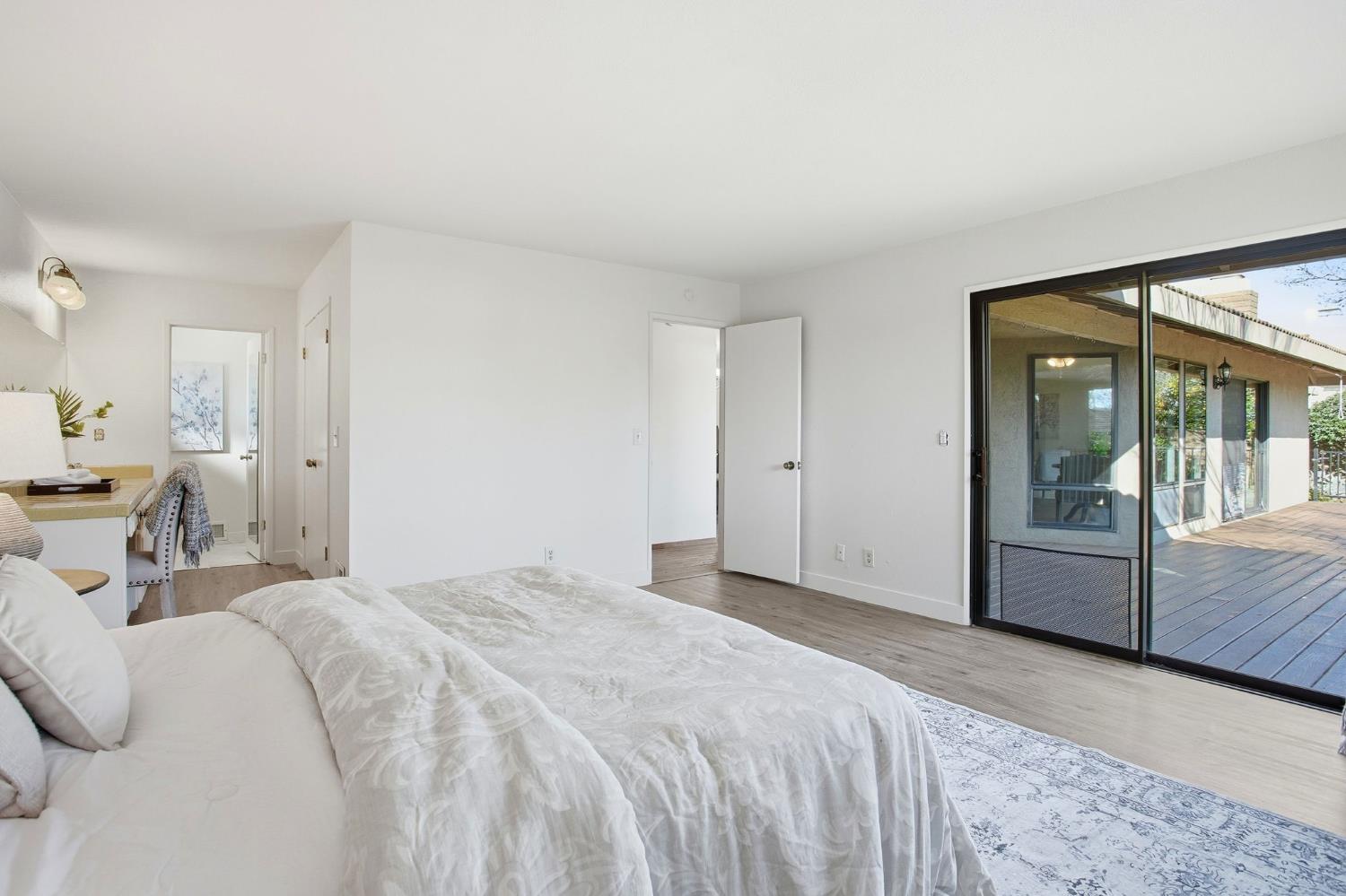 6923 Pera Drive Rancho Murieta, CA 95683 - Photo 20 of 35 a bedroom with a bed and a large window