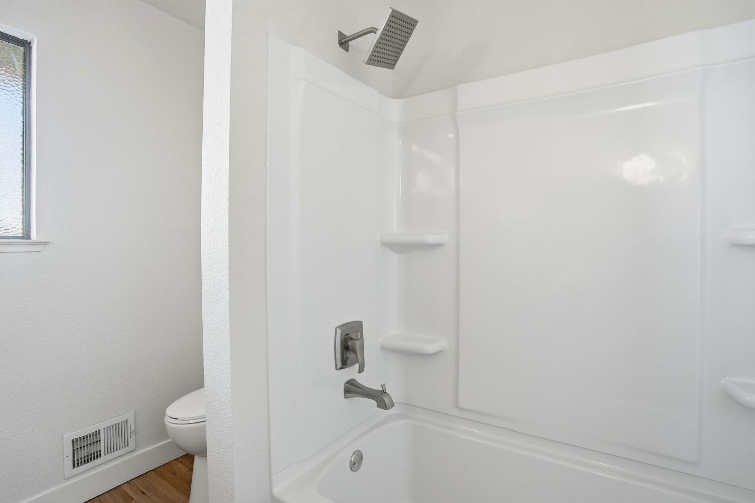 6923 Pera Drive Rancho Murieta, CA 95683 - Photo 23 of 35 a bathroom with a granite countertop toilet and a tub