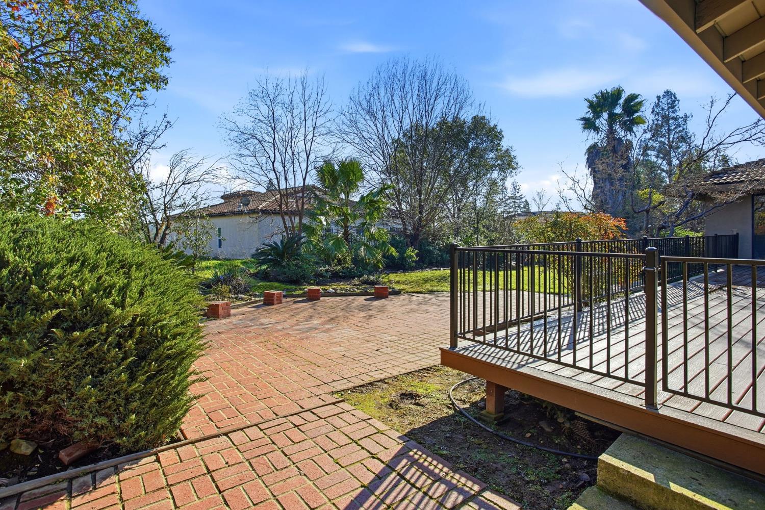 6923 Pera Drive Rancho Murieta, CA 95683 - Photo 32 of 35 a view of a backyard with a iron fence